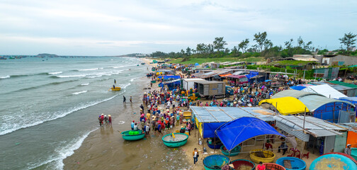 Mui Ne fish market seen from above, the morning market in a coastal fishing village to buy and sell seafood for the central provinces of Vietnam