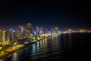 The coastal city of Nha Trang seen from above at night. This is a famous city for cultural tourism in central Vietnam