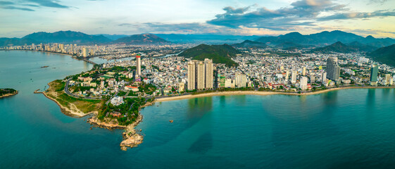 Fototapeta premium The coastal city of Nha Trang seen from above in the morning, beautiful coastline. This is a city that attracts to relax in central Vietnam