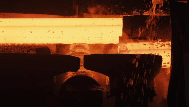 Metallurgical production, heavy industry, engineering, steelmaking. Red hot steel metal billets after molten steel casting. Continuous casting machine. Hot steel pouring in steel plant.4K