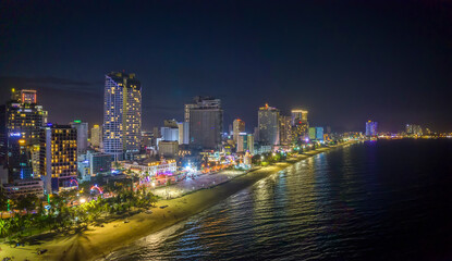 The coastal city of Nha Trang seen from above at night. This is a famous city for cultural tourism in central Vietnam