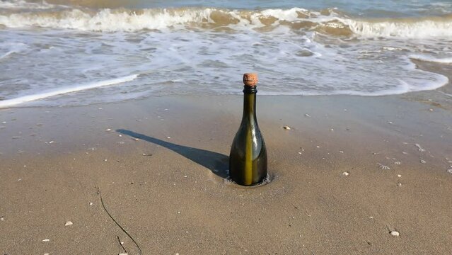 bottle with a secret message carried by the waves of the sea