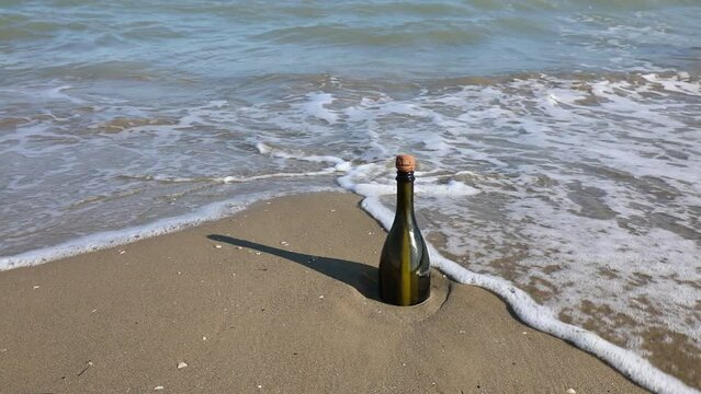 bottle with a secret message carried by the waves of the sea