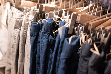 Selective focus, Fashion , clothes concept ,Clothes or pants many colors hang on a shelf in a...