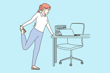 Businesswoman do gymnastics at workplace
