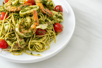Spaghetti with seafood in homemade pesto sauce