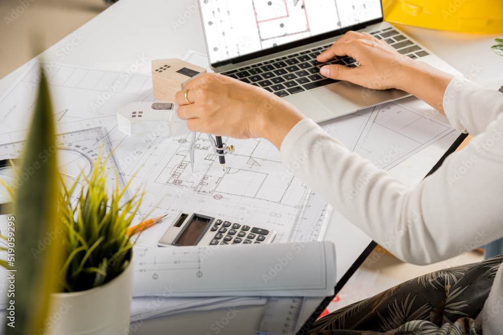 Poster architectural project workplace. architect typing laptop keyboard to review design of house before e