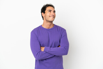 Caucasian handsome man over isolated white background looking up while smiling