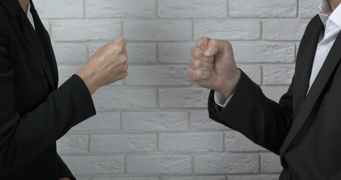 Gesture on rock paper scissors. A businessman with his partner play the rock paper scissors in the office.
