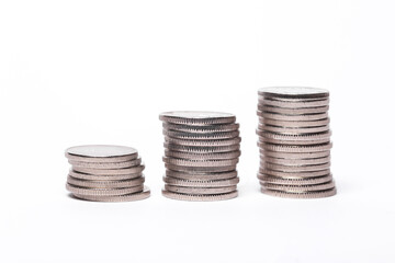 Three stacks of coins isolated on white background