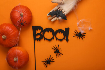 Flat lay halloween orange background from themed decor. Top view. Creative layout