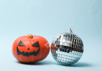 Halloween party. Halloween pumpkin with disco ball on blue background