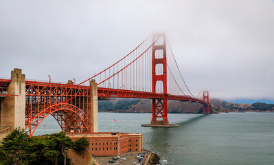 Golden Gate bridge with low fog rolling in San Francisco, California
