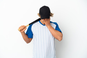 Young blonde man playing baseball isolated on white background with tired and sick expression