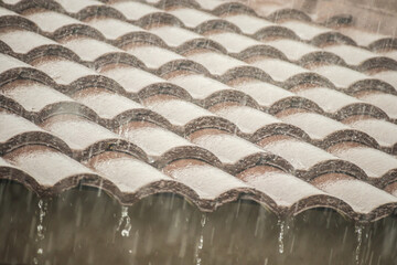 rain falling down from the house roof