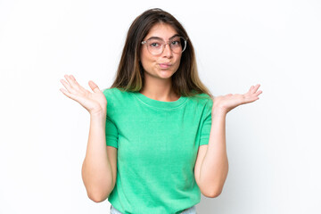 Young caucasian woman isolated on white background having doubts while raising hands