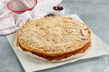 Sweet bakery - poppy pie with cottage on gray stone background. Poppy and cottage cheese cake in rustic style on stone table. Aesthetic composition with poppy seed pie. Cottage cheese dessert.
