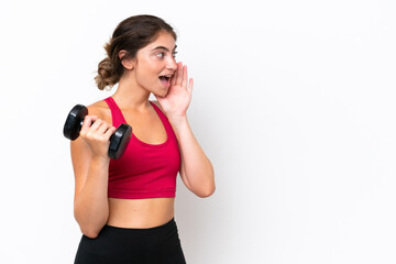 Young sport caucasian woman making weightlifting isolated on white background shouting with mouth wide open to the side