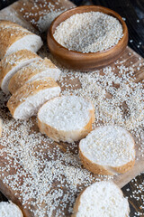 Fototapeta na wymiar wheat grain baguette sprinkled with sesame seeds