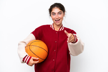 Young basketball player woman isolated on white background shaking hands for closing a good deal