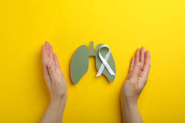 Lung Cancer Awareness Month concept on yellow background