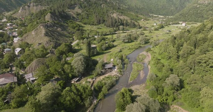 Aerial View Of Idyllic Daba Town With Forested Mountainscape At Background In Georgia - drone shot