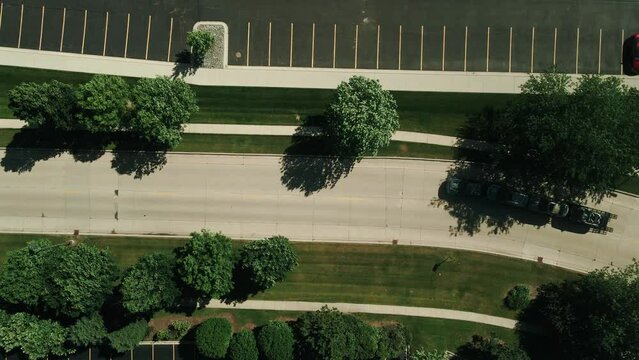 top down car hauler truck driver driving with 3 cars on trailer while drone is following 4k