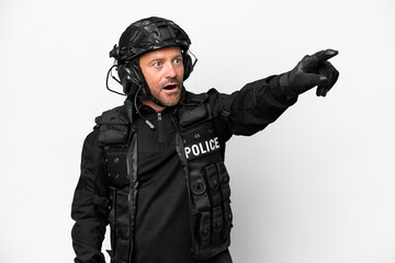 Middle age SWAT man isolated on white background pointing away