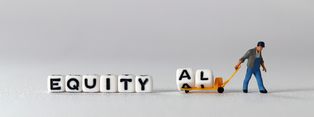 White cube with the word 'EQUALITY'. The concept of equality and equity. Miniature people and...