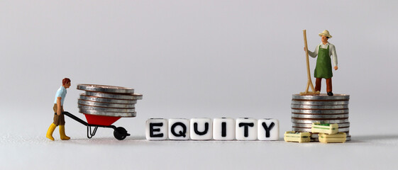 White cube with the word 'EQUITY'. Pile of coins and miniature people with business concept.
