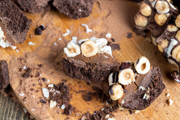 multicomponent cake made of caramel and nuts in chocolate