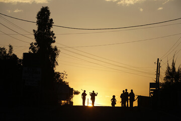 Fototapeta na wymiar Figures at dusk in Lalibela