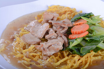 crispy yellow noodle with in a creamy gravy sauce : chinese and thai style food. in thai language call is 