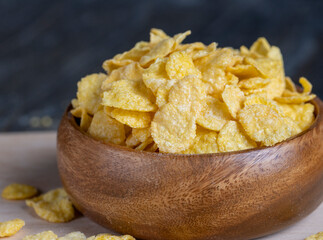 dry breakfast corn flakes of yellow color , close up