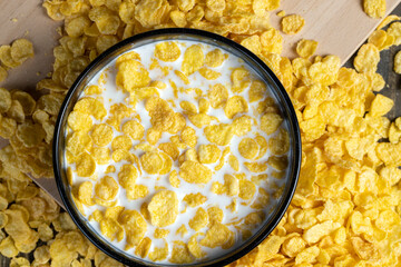 dry breakfast corn flakes of yellow color , close up