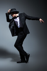 dancer in black suit