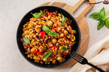 Overhead view of Caponata siciliana - Italian, Sicilian stew consisting of chopped fried aubergine...