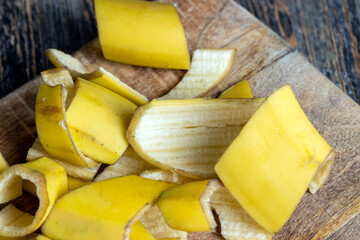 the yellow peel that was left after the bananas on the board