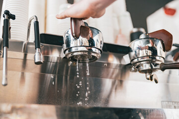 Process of preparing coffee on coffee machine in cafe