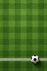 Soccer field or Football field with soccer ball on green grass background