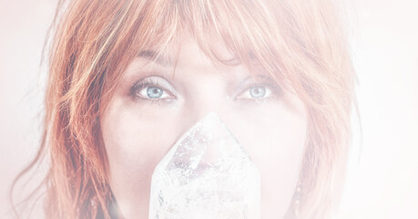 Woman face and crystal on crystal background.