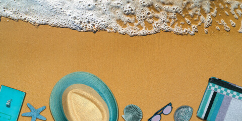 Fototapeta na wymiar Topview Beach Accessories Background on Sand and Sea Wave
