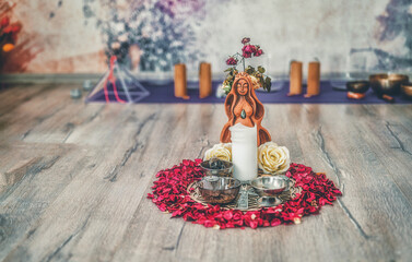 Beautiful altar with rose petals and goddess breasts. ceremony space.