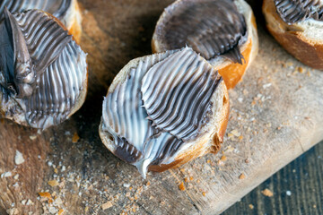 baguette with sweet chocolate butter on a board