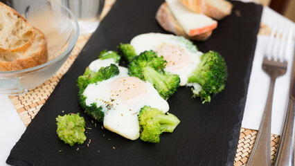 breakfast of crumpled eggs with broccoli