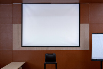 blank white screen hanging in classroom