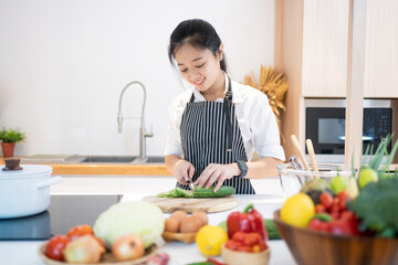 Asian woman cooking at home