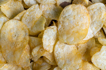 scattered potato chips with natural spices