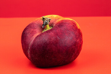Donut Peaches isolated in red background