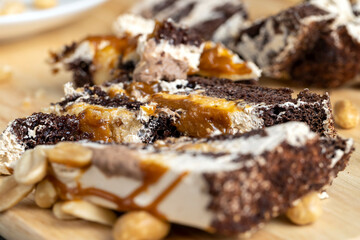 caramel cake with peanuts and buttercream, close up